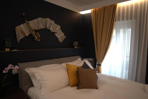 Letto o letti in una camera di Dimora del Teatro