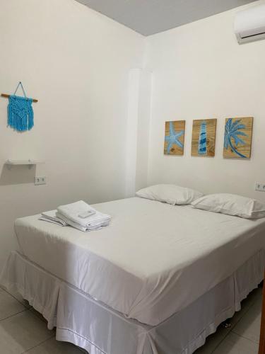 A bed or beds in a room at Villa Maragogi Hostel