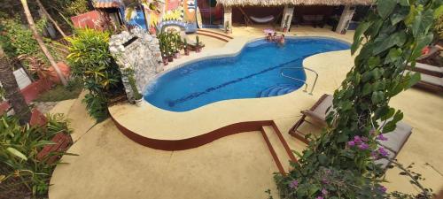 an overhead view of a swimming pool in a resort at Massai Apartments in Playa Flamingo