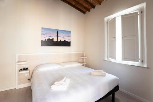 Posteľ alebo postele v izbe v ubytovaní Albergo Centrale