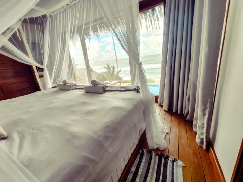 Una cama o camas en una habitación de The Beach House