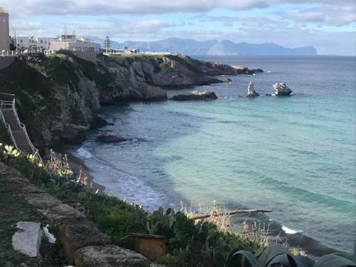 a view of a beach with the ocean at By the Sea in Terrasini