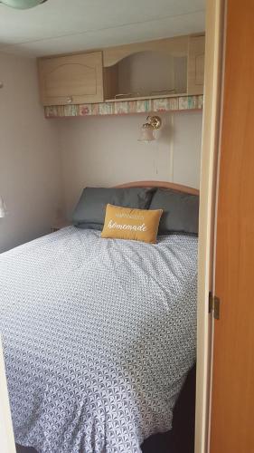 a bed in an rv with a pillow on it at The Chase Ingoldmells in Ingoldmells