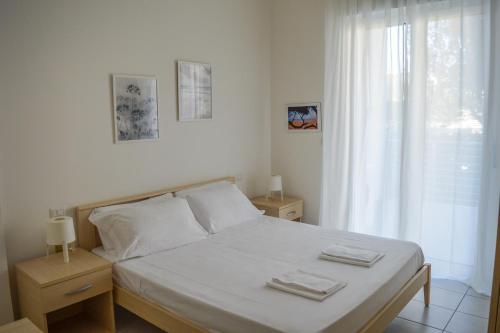 Säng eller sängar i ett rum på Homiday - Appartamenti I Gabbiani