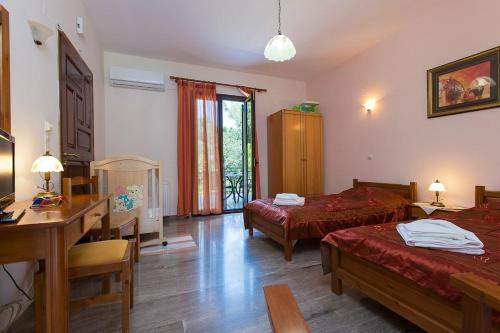 A bed or beds in a room at Aphrodite Villa