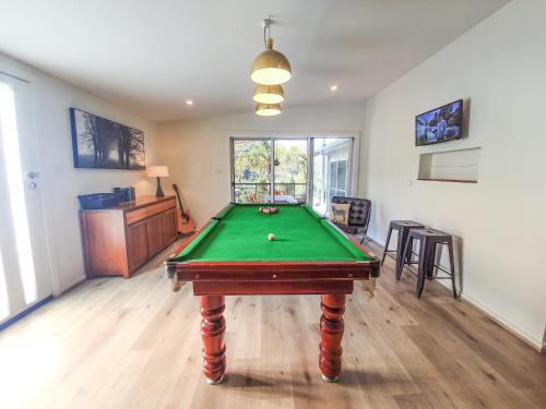 a living room with a pool table in it at RIVERLEA RETREAT MUDGEE - Private, Outdoor Bath, Pool, Tranquility in Apple Tree Flat
