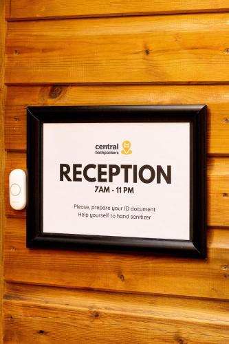 a sign on a wall that reads respiration at Central Backpackers in Oxford