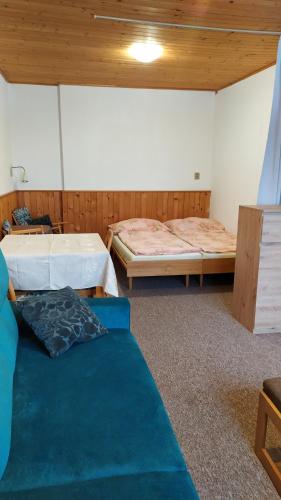 Postel nebo postele na pokoji v ubytování Chata-R Mariánská