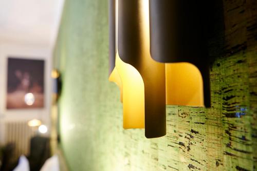 a pair of lights hanging on a wall at Bubble 8 in Épernay