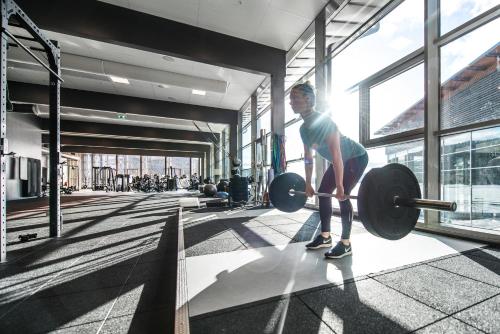 a man standing in a gym lifting weights at Holiday Club Åre in Åre
