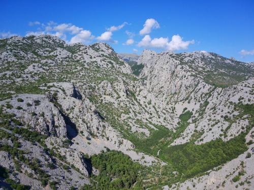 an aerial view of a mountain range with trees at Seline Summer Home in Seline