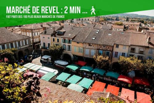 an overhead view of a city with buildings and roofs at LOFT DU GET in Revel