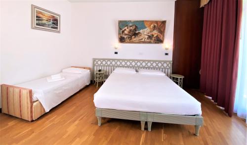 Cama o camas de una habitación en Park Hotel Junior