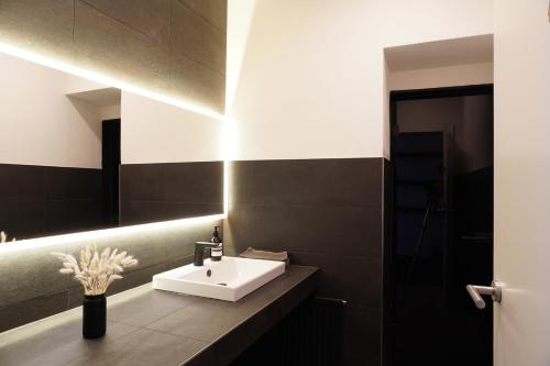 a bathroom with a sink and a mirror at Hotel Berghof in Seefeld in Tirol