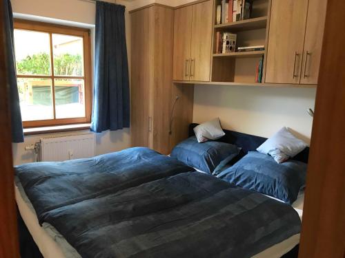 Postel nebo postele na pokoji v ubytování Alpen Suite Abwinkl