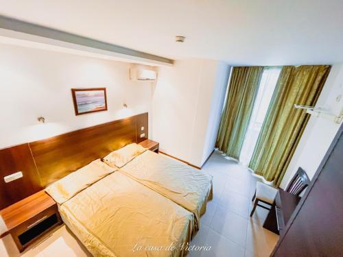 En eller flere senge i et værelse på La casa de VICTORIA - Holiday apartment