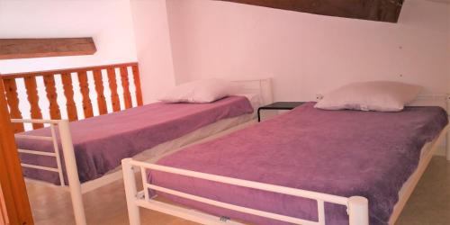 two beds sitting next to each other in a room at Résidence Cap Azur Appartement 237 in Villeneuve-Loubet