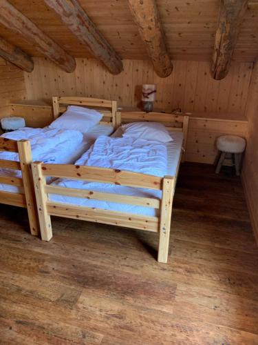 Postel nebo postele na pokoji v ubytování Chalet à la montagne