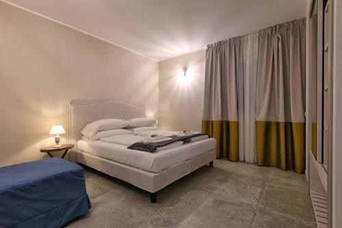 Lova arba lovos apgyvendinimo įstaigoje La Dolce Vita Relais - Hotel Gallo