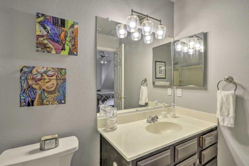 a bathroom with a sink and a mirror at Cozy Cabin about 3 Mi to Lake Arrowhead Village! in Lake Arrowhead