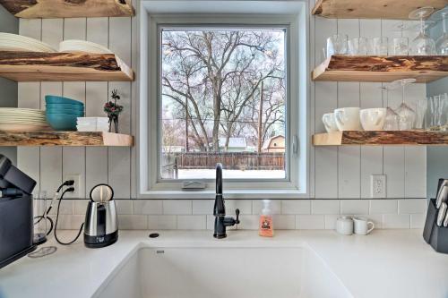 a kitchen counter with a sink and a window at Contemporary Longmont Hideaway in Old Town! in Longmont