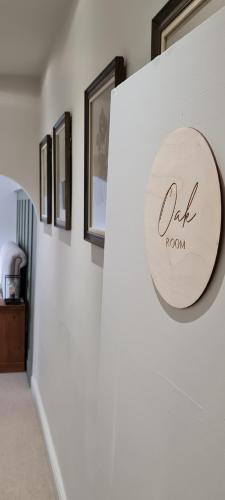 a sign that reads oak room on a wall at The Family Tree in Whatstandwell