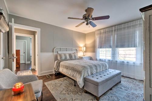 a bedroom with a bed and a ceiling fan at Modern Florence Getaway with Patio and Grill! in Florence