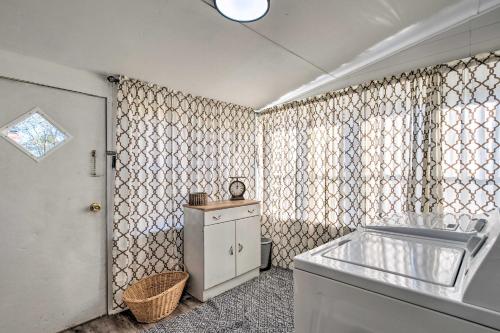 a bathroom with a sink and a window at Modern Florence Getaway with Patio and Grill! in Florence