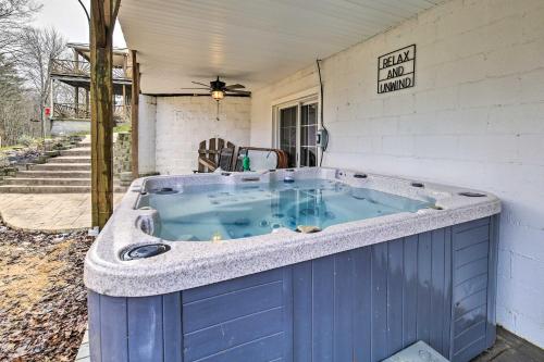a blue bath tub sitting on the side of a house at Beckley Studio with Hot Tub, 4 Mi to WVU Tech! in Beckley