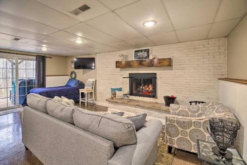 a living room with a couch and a fireplace at Beckley Studio with Hot Tub, 4 Mi to WVU Tech! in Beckley