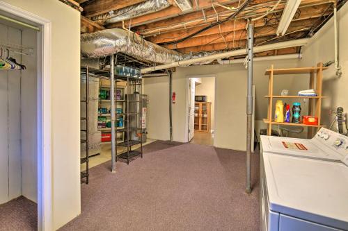 an empty room with a garage with shelves and a vaulted ceilings at Beckley Studio with Hot Tub, 4 Mi to WVU Tech! in Beckley