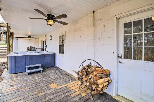 a porch with a blue cabinet and a ceiling fan at Beckley Studio with Hot Tub, 4 Mi to WVU Tech! in Beckley