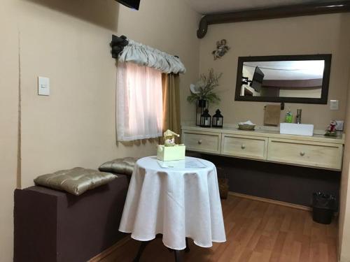 a room with a table with a cake on it at Casa de las Escaleras in Pátzcuaro