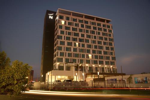 a tall building with a fence in front of it at Novotel Arica in Arica