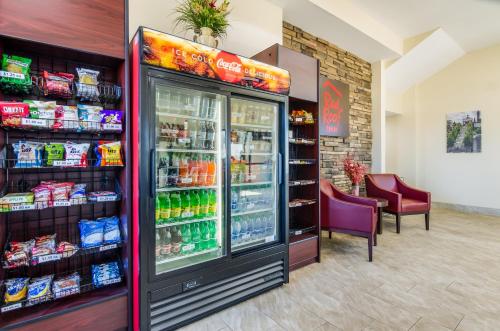 a refrigerator in a store with drinks in it at Red Roof Inn Madison Heights, VA in Lynchburg