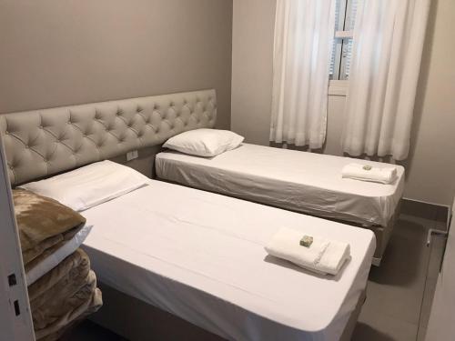 Ein Bett oder Betten in einem Zimmer der Unterkunft Chalé Serra do Luar
