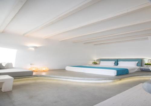 a bedroom with two beds and a swimming pool at Princess Of Naxos in Naxos Chora