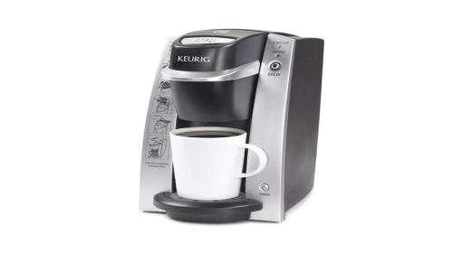 a coffee maker with a cup of coffee at Holiday Inn - Ottawa Dwtn - Parliament Hill by IHG in Ottawa