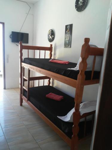 a couple of bunk beds in a room at Pousada Ilha Margarita in Florianópolis