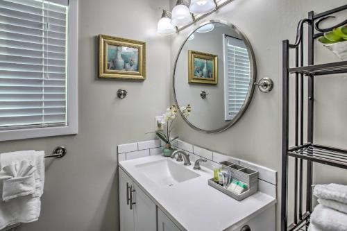 a bathroom with a sink and a mirror at Walk to Beach Dog-Friendly Myrtle Beach Cottage! in Myrtle Beach