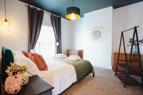 a bedroom with a bed and a window at Gladstone House in Chester