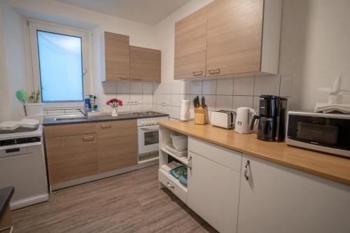 Kuchyň nebo kuchyňský kout v ubytování 4-Zimmer Haus, 2-Bäder 140qm bis zu 11 Personen