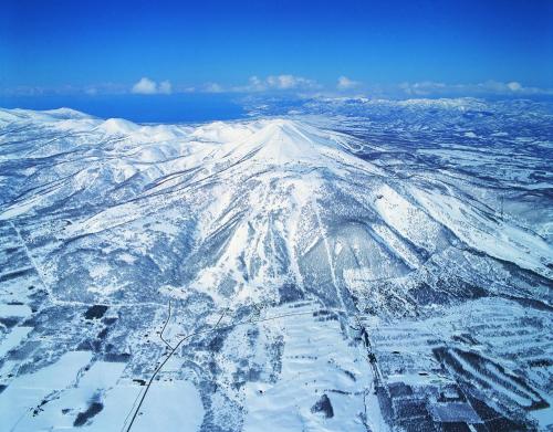 an aerial view of a snow covered mountain at Kasara Niseko Village Townhouse in Niseko