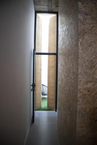 an open door to a room with a window at Urban Sal Loft in Espargos