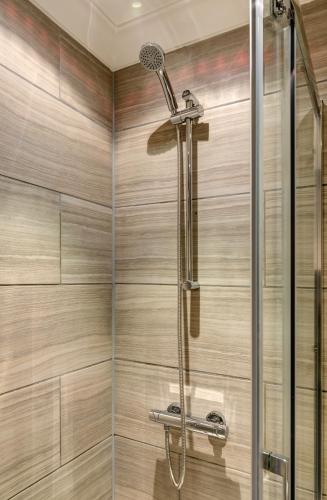 a bathroom with a shower with a glass door at Cosy 2 bed home CHESTERFIELD in Chesterfield