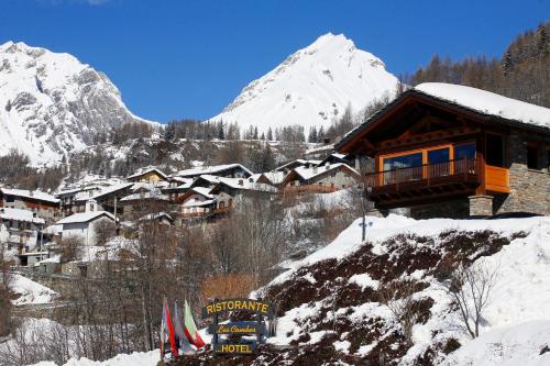 a ski lodge in the mountains with snow on the ground at Les Combes in La Salle