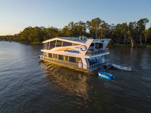 a ferry boat on the water on a river at All Seasons Houseboats in Mildura