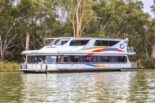 a large white boat on the water at All Seasons Houseboats in Mildura