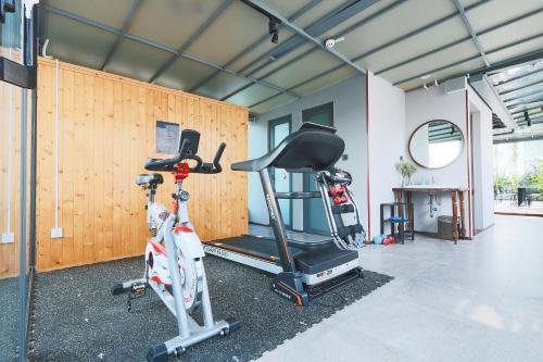 a gym with a bike and a treadmill at CHERRY BOUTIQUE HOTEL in Ho Chi Minh City
