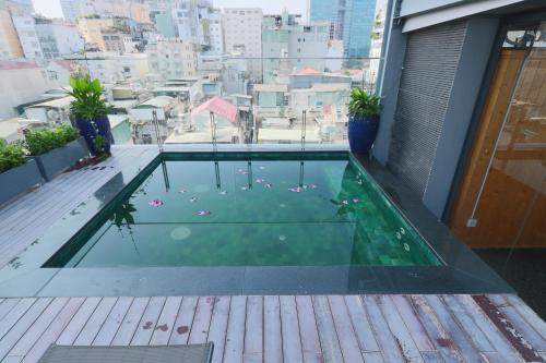 a swimming pool on the roof of a building at CHERRY BOUTIQUE HOTEL in Ho Chi Minh City
